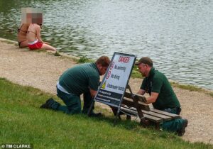 Crackdown on ‘selfish’ sunseekers: Hampstead Heath rangers install ‘no swimming’ signs after crowds ignore bird pond ban to take a dip during heatwave