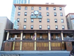 It was the inspiration for the iconic red hotel in Monopoly and open 24/7 but now pub that never closed could be shut forever amid fight over its HEIGHT
