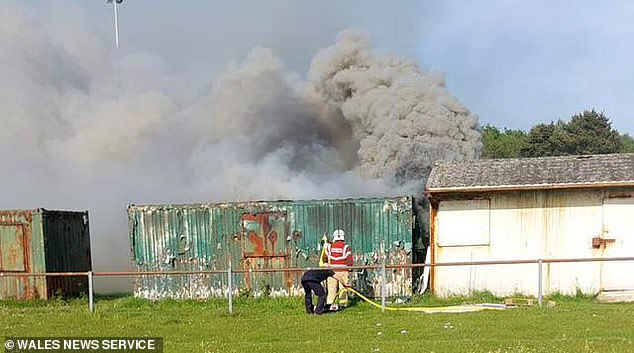 ‘Screaming’ boy, 11, saved by heroic group of fathers after he was trapped in burning storage container – as teen, 13, is arrested over ‘attempted murder’