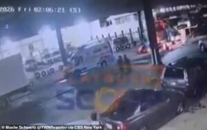 Mystery as large group of men emerge from manhole into middle of busy Brooklyn street as police place area in lockdown