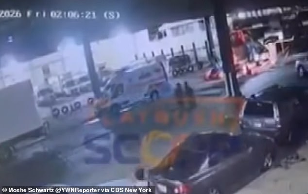 Mystery as large group of men emerge from manhole into middle of busy Brooklyn street as police place area in lockdown