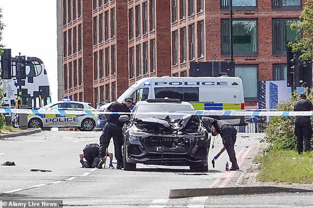 Woman, 28, dies when she is hit by Audi in city centre in the early hours as man, 22, is arrested