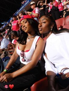 Bukayo Saka’s fiancée Tolami Benson stuns in red as she leads the glamorous WAGs cheering on Arsenal from the stands at the Champions League final