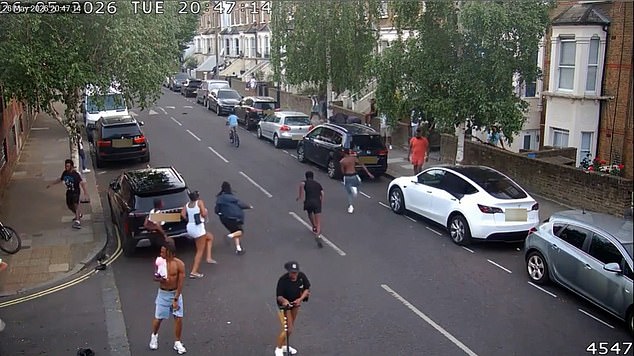 Moment terrified witnesses flee after man, 20, stabbed to death in daylight attack on London street – as two men arrested