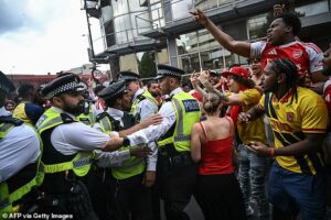 Nine people are arrested at Premier League title parade in north London as chaos erupts following Champions League defeat