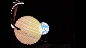 Earth photobombs a satellite deploying its giant reflector photo of the day for May 14, 2026