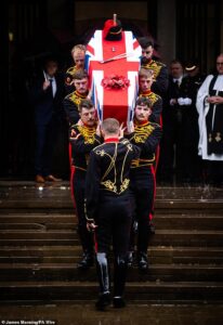 Mourners honour female soldier at funeral after she was thrown from a horse to her death moments after performing in front of the King