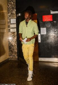 Top male model pulls blue steel pose in court as he’s charged with stealing $1m of clothing from upscale Soho boutique