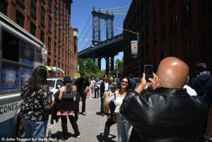 Locals moved there for a more tranquil NYC life but are now furious neighborhood has turned into ‘the Times Square of Brooklyn’ with wall-to-wall tourists