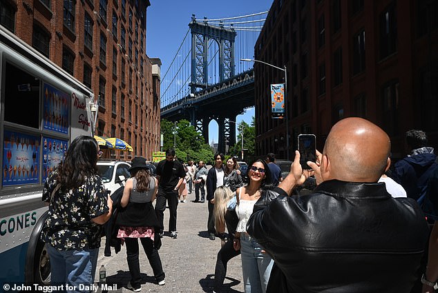 Locals moved there for a more tranquil NYC life but are now furious neighborhood has turned into ‘the Times Square of Brooklyn’ with wall-to-wall tourists