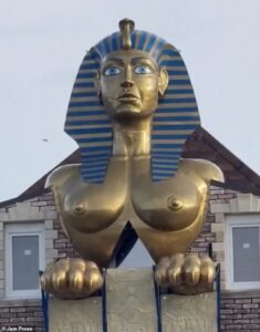 He sphinx it’s all over! Former owner of Hearts FC installs busty Egyptian-style golden statue on top of his house