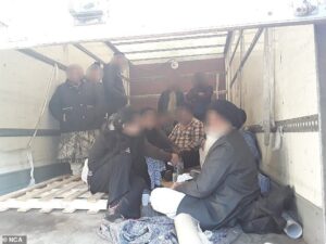 Moment police find Afghan migrants including a child hiding in lorry before Dad’s Army trafficking gang pockets £65,000 for organising the trip