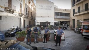 Police arrive at Dua Lipa’s wedding venue as locals in Palermo erect posters declaring ‘the city is not for rent’ amid claims Sicily has been ‘shut down for singer’s three-day wedding extravaganza’
