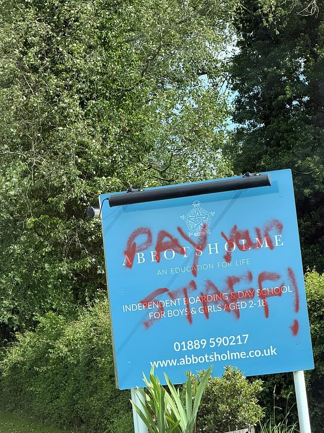 Furious staff at 137-year-old private school deface signs and children are left in tears after new owners tell them they are shutting down in two weeks