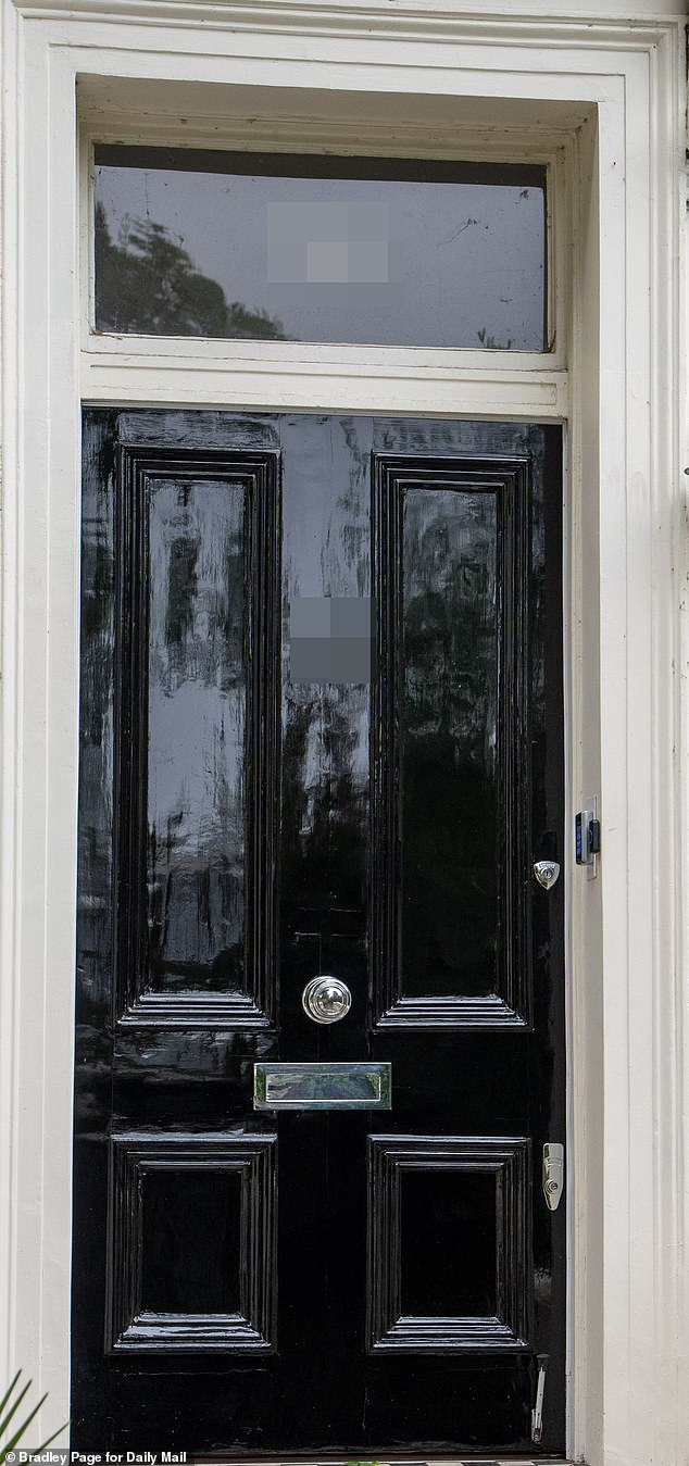 Paint it black! Rolling Stones icon Ronnie Wood is ordered to replace bright pink door on his £7million west London mansion by jobsworth council