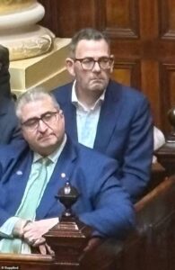 Sombre-looking Dan Andrews makes his first public appearance in months as he dons a blue suit and returns to parliament after secret health battle
