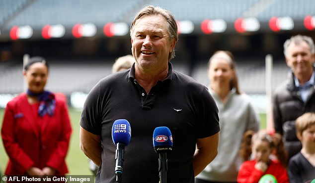 AFL great Tony Modra is left fighting for life after his truck crashed into a tree