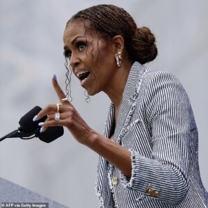 Michelle Obama dispels her rocky marriage rumors as she sings husband Barack’s praises… but one eyebrow raising comment suggests it’s not all plain sailing