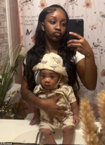 Devastated mom of one-year-old shot dead by police outside a Walmart reveals how she frantically tried to show officers he was in the car …as furious protesters met with tear gas