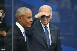 Joe Biden mumbles to himself and requires stage direction as he aimlessly wanders off at Obama’s library debut