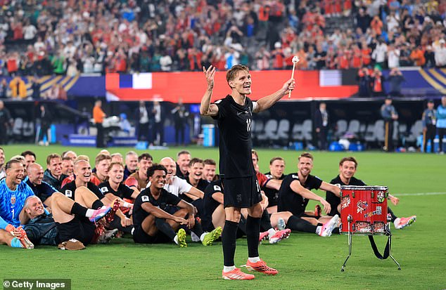 Martin Odegaard leads his Norway team-mates in incredible Viking Row celebration after cruising into World Cup knockouts – as Erling Haaland and Co stick to their roots after causing a stir with controversial team photo