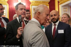 King Charles is fanned by top aide as monarch feels the heat during royal visit on hottest June day ever