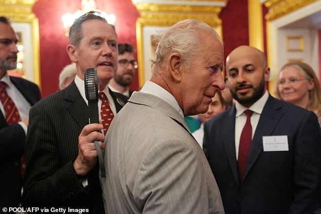 King Charles is fanned by top aide as monarch feels the heat during royal visit on hottest June day ever