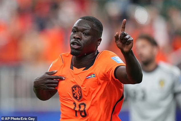 The Netherlands’ deadly striker who bounced back from extortion nightmare to shine at the World Cup: Brian Bobbey escaped Amsterdam gang violence and is now bullying defences for Ronald Koeman’s side
