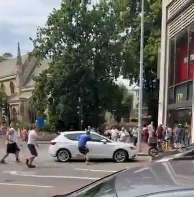 Somalia-born man, 34, is charged with attempted murder after five people were struck by a car in London