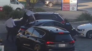 Wild scenes unfold at a Melbourne petrol station as THREE unmarked police cars swoop in on a driver