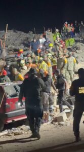 Remarkable moment two boys, 11, are pulled alive from earthquake rubble hours apart in Venezuela as tens of thousands remain missing