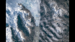 Astronauts watch from space as ice splinters from a glacier photo of the day for June 11, 2026