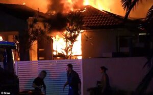 Man dies and two are left fighting for life after a suspected arson attack destroys Gold Coast home