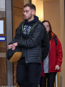 Cops raid Marymede Catholic College and charge Melbourne sport assistant, 24, with sexually penetrating a child: What parents were told – as he’s unmasked for the first time