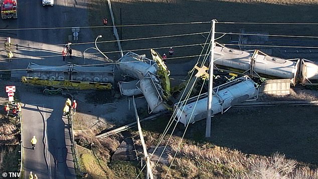 Train derails in small town as emergency services race to clear the wreckage