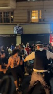 Egyptian fans bring chaos to London as they battle with police and climb on double decker bus to celebrate team’s World Cup win