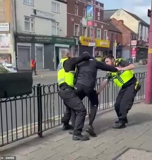 Moment police officer is hit with his own baton in chaotic stop and search – before suspect flees on e-bike