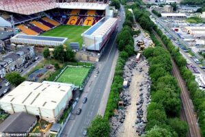 Illegal 7,500-tonne waste dump is found next to football stadium after locals noticed smell of rotting food during heatwave