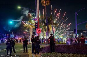 Luxurious beach town descends into riots as 400 are arrested as horse-riding police swarm out-of-control July 4 celebrations