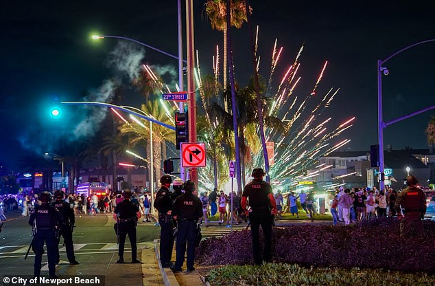 Luxurious beach town descends into riots as 400 are arrested as horse-riding police swarm out-of-control July 4 celebrations