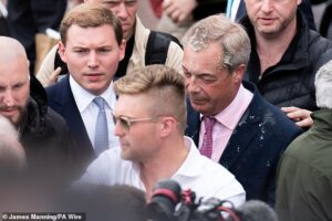 Trump backs Farage as Reform leader returns from US to face questions over deepening row over his finances – and clashes with cameraman