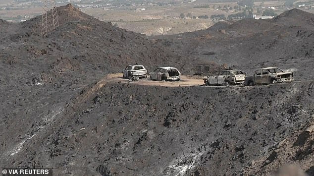 Wildfire Brits’ doomed escape convoy: Haunting image shows how fleeing victims of Spanish inferno were left stranded, with one attempting to turn back before inferno swept over them