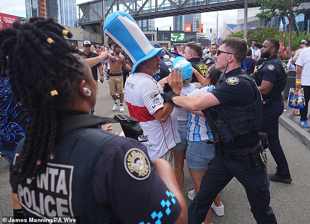 Aggro on the streets of Atlanta: Armed police arrest England and Argentina fans as supporters spill out of stadium following Three Lions’ loss