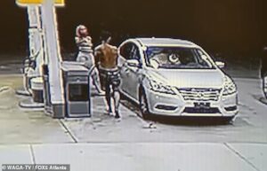 Heart-stopping moment mother uses GAS PUMP to defend her child from stranger intent on abducting him from gas station in dead of night