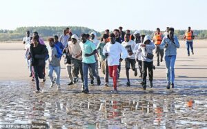 Hundreds more migrants rush to board Channel dinghies just hours after Andy Burnham boasted of success in stopping them