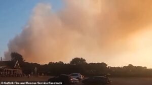 Holidaymakers evacuated as firefighters battle huge wildfire in Suffolk