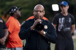 Seattle police chief is FIRED by woke mayor after he was filmed squaring up to reporter who asked him about deadly shooting