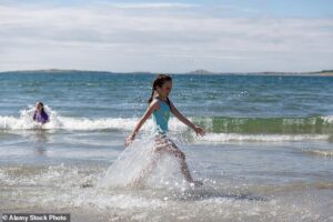 Entitled beachgoer slammed for complaining after small child decided to play in the water near her sun lounger: ‘It’s in my space’
