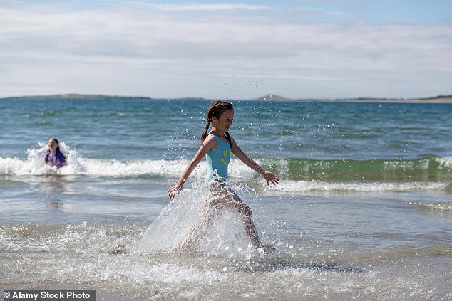 Entitled beachgoer slammed for complaining after small child decided to play in the water near her sun lounger: ‘It’s in my space’