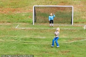 Model village is forced to remove figurine of topless streaker after ‘small number’ of visitors complained it was ‘inappropriate’